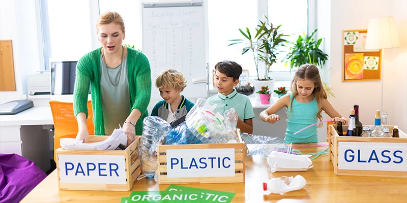 Group sorting paper, plastic, and glass into labeled crates in a recycling station - Solutions to Improve Scrap Recycling.